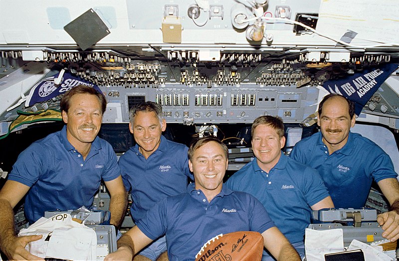 STS-27 crew poses for inflight portrait on forward flight deck with football / NASA