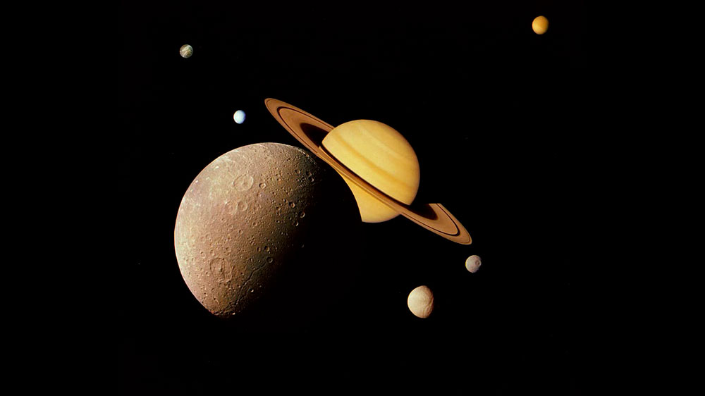 Impresión artística de Saturno y algunas de sus lunas más grandes